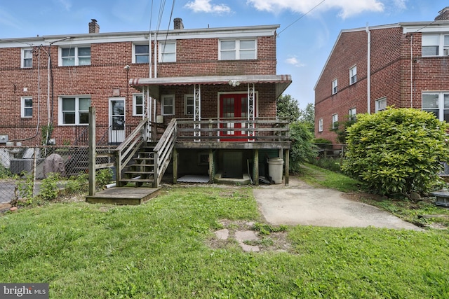 234 Linden Ave, Towson, MD 21286 - rear view of property with brick siding and a wooden deck