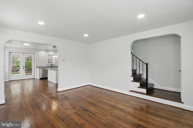 234 Linden Ave, Towson, MD 21286 - unfurnished living room featuring arched walkways, dark wood-type flooring, recessed lighting, stairway, and baseboards