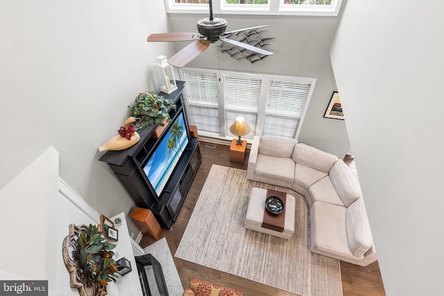 48 Avalon Ct Unit 2301, Doylestown, PA 18901 - living room with ceiling fan, a towering ceiling, wood finished floors, and a fireplace