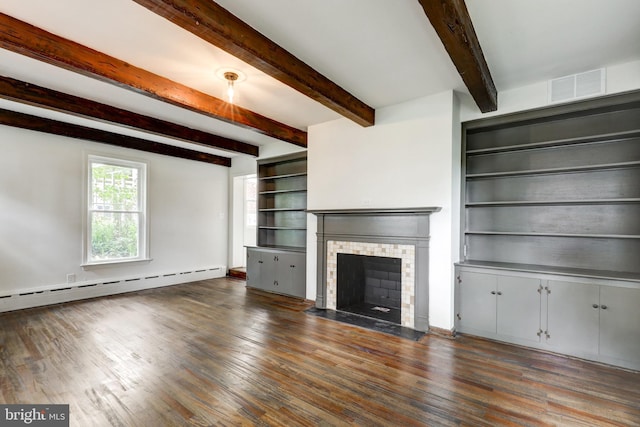 515 Devon Rd, Havertown, PA 19083 - unfurnished living room featuring wood finished floors, a baseboard heating unit, a brick fireplace, beamed ceiling, and baseboards