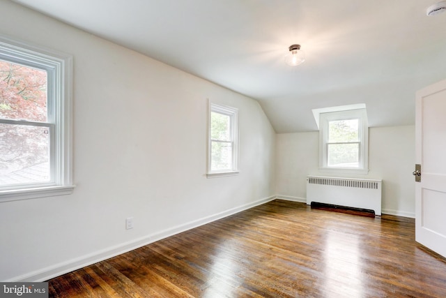 515 Devon Rd, Havertown, PA 19083 - additional living space featuring radiator, wood finished floors, lofted ceiling, and baseboards