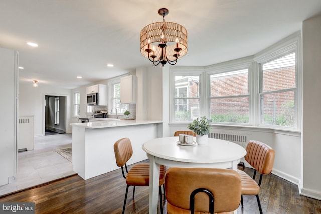 515 Devon Rd, Havertown, PA 19083 - dining space featuring plenty of natural light, wood finished floors, recessed lighting, a chandelier, and baseboards