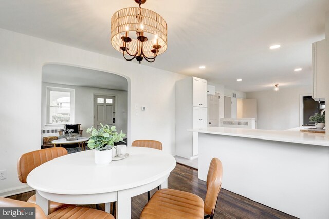 515 Devon Rd, Havertown, PA 19083 - dining area featuring arched walkways, dark wood-style floors, recessed lighting, and a chandelier