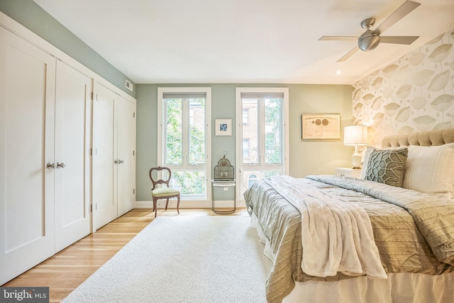 510 Pine St, Philadelphia, PA 19106 - bedroom with light wood-style flooring, baseboards, two closets, and ceiling fan