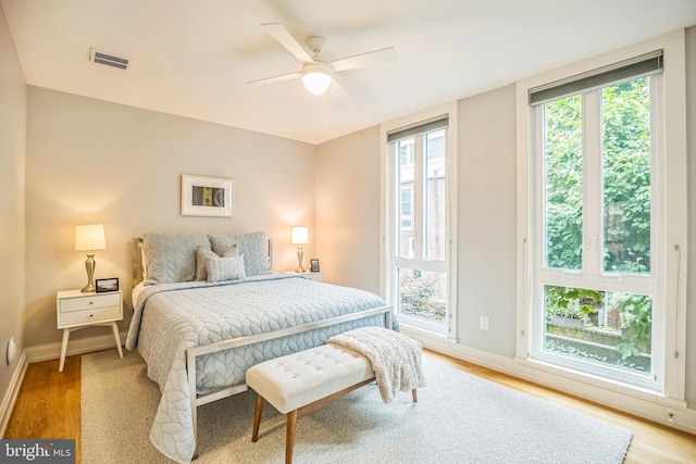 510 Pine St, Philadelphia, PA 19106 - bedroom with multiple windows, light wood finished floors, and baseboards