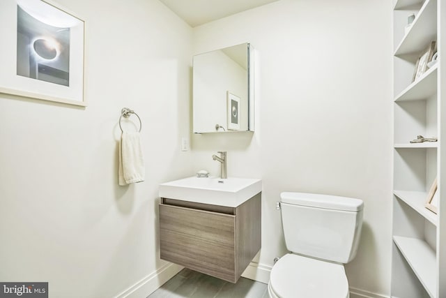 510 Pine St, Philadelphia, PA 19106 - half bath featuring baseboards, vanity, and toilet