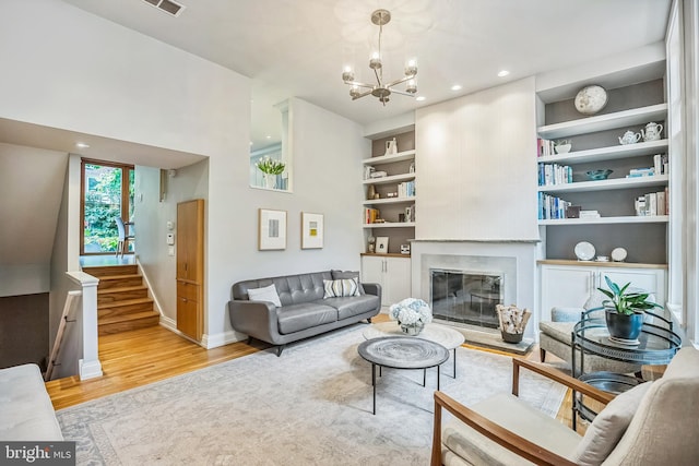 510 Pine St, Philadelphia, PA 19106 - living area featuring wood finished floors, a chandelier, baseboards, stairway, and recessed lighting