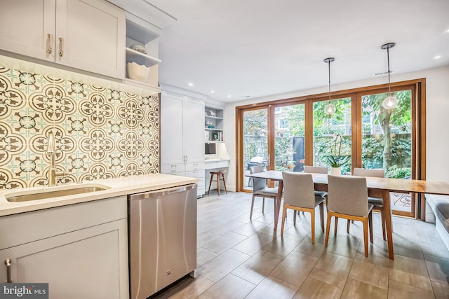 510 Pine St, Philadelphia, PA 19106 - kitchen featuring open shelves, dishwasher, a sink, light countertops, and hanging light fixtures