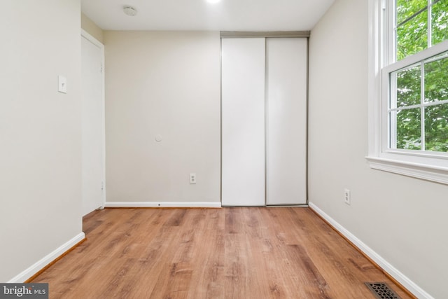 122 Sharpstead Ln, Gaithersburg, MD 20878 - unfurnished bedroom with light wood-style floors, baseboards, and a closet
