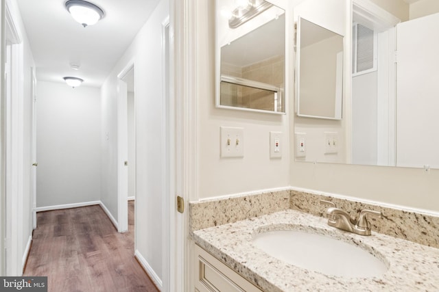 122 Sharpstead Ln, Gaithersburg, MD 20878 - bathroom featuring wood finished floors, vanity, and a shower with shower door