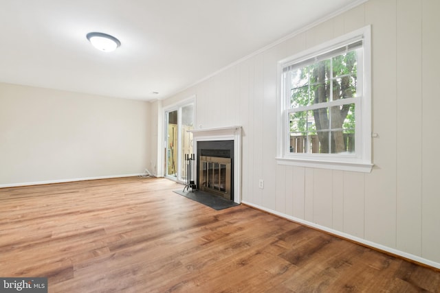 122 Sharpstead Ln, Gaithersburg, MD 20878 - unfurnished living room featuring a fireplace with flush hearth, wood finished floors, crown molding, and baseboards