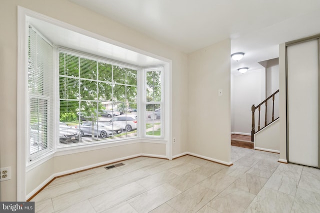 122 Sharpstead Ln, Gaithersburg, MD 20878 - spare room featuring plenty of natural light, baseboards, and stairs