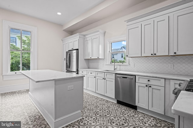 3 E Poplar St, Wenonah, NJ 08090 - kitchen with stainless steel appliances, a sink, plenty of natural light, backsplash, and recessed lighting