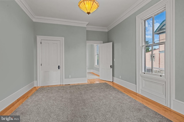 3 E Poplar St, Wenonah, NJ 08090 - unfurnished bedroom featuring multiple windows, light wood-style flooring, ornamental molding, and baseboards