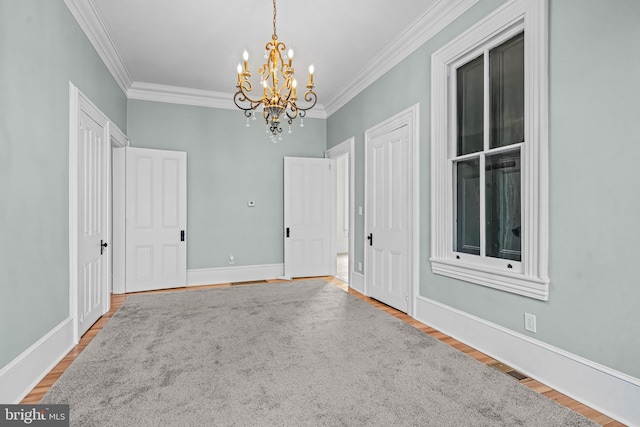 3 E Poplar St, Wenonah, NJ 08090 - spare room with a chandelier, crown molding, wood finished floors, and baseboards