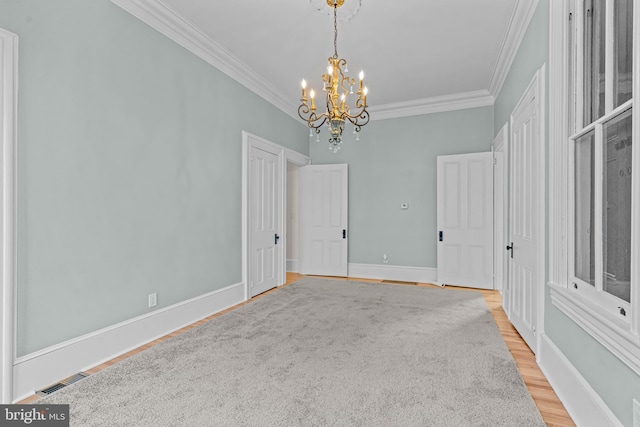 3 E Poplar St, Wenonah, NJ 08090 - spare room with crown molding, a chandelier, light wood finished floors, and baseboards