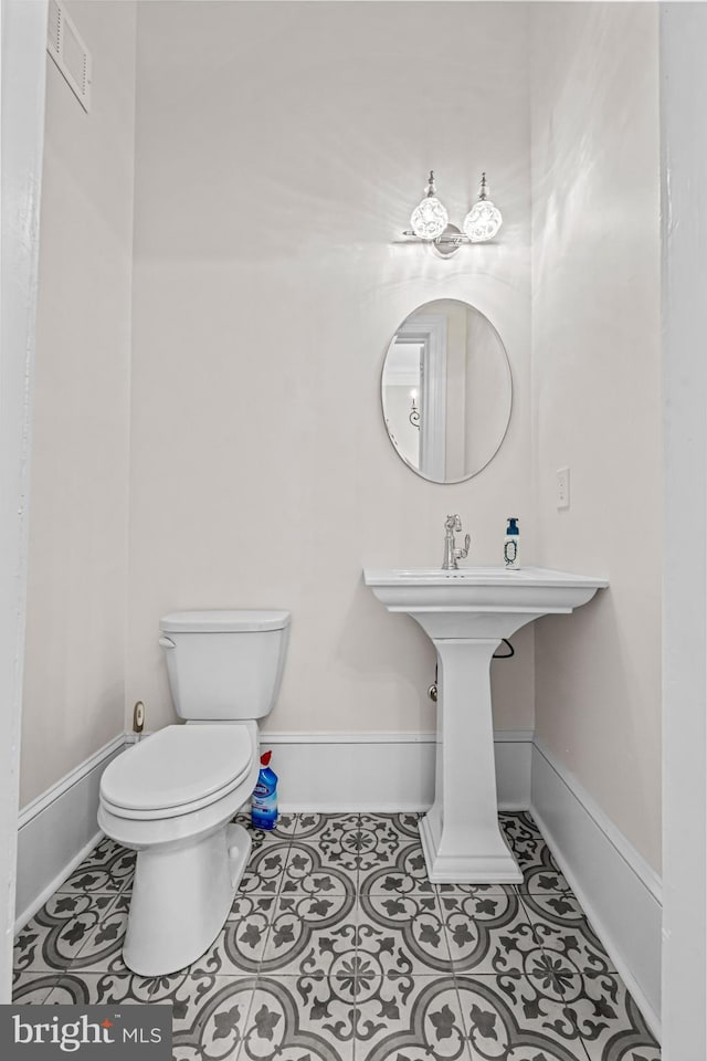3 E Poplar St, Wenonah, NJ 08090 - bathroom with toilet, baseboards, tile patterned floors, and a sink
