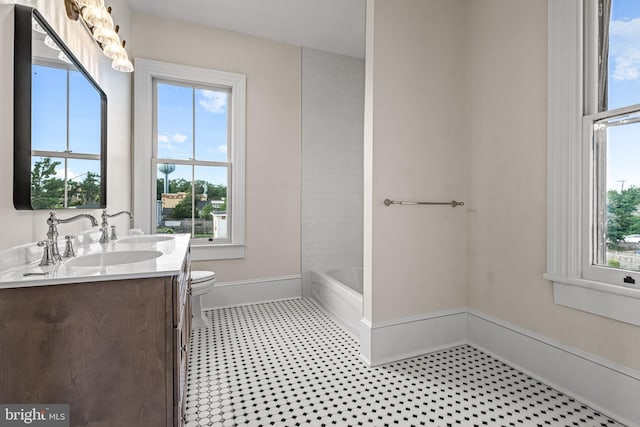 3 E Poplar St, Wenonah, NJ 08090 - bathroom featuring double vanity, baseboards, and plenty of natural light
