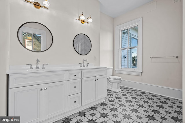 3 E Poplar St, Wenonah, NJ 08090 - full bath featuring tile patterned floors, double vanity, toilet, and baseboards