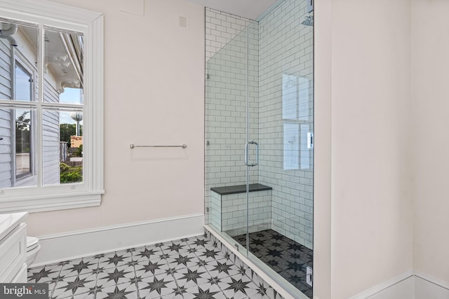 3 E Poplar St, Wenonah, NJ 08090 - bathroom with tile patterned floors, a shower stall, vanity, toilet, and baseboards