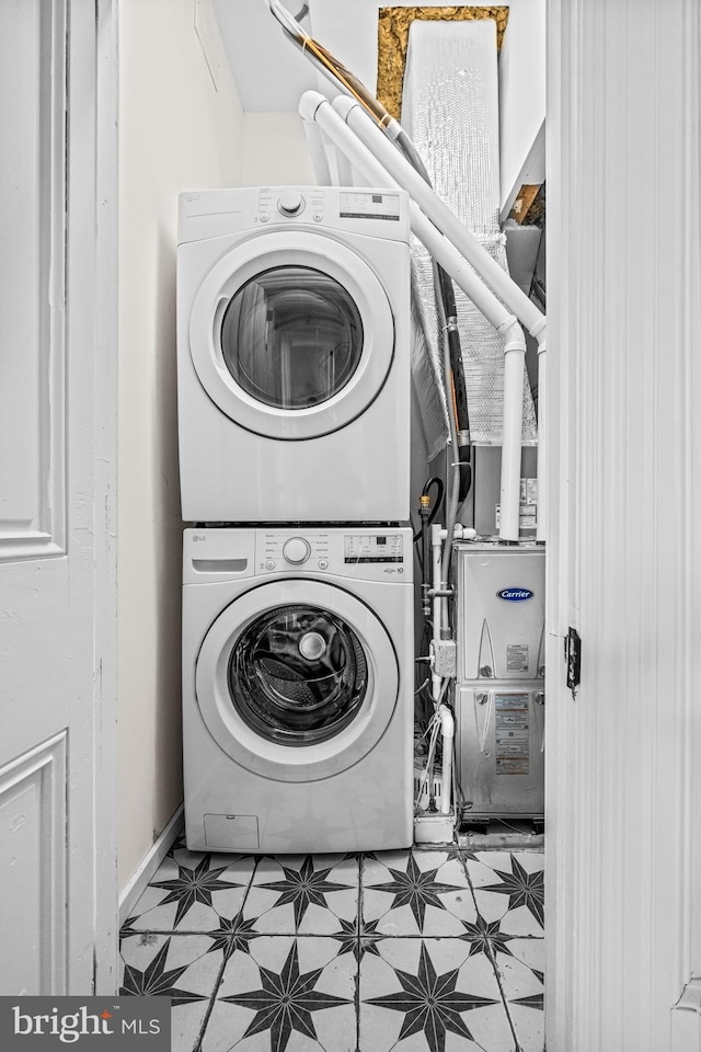 3 E Poplar St, Wenonah, NJ 08090 - washroom featuring stacked washer and clothes dryer and tile patterned floors