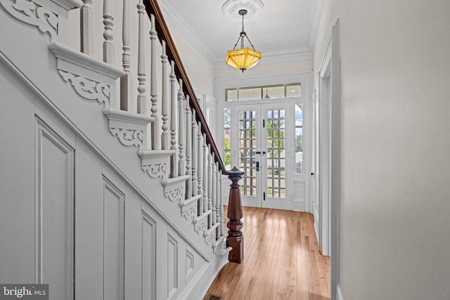 3 E Poplar St, Wenonah, NJ 08090 - foyer entrance with ornamental molding, french doors, stairs, and light wood-style flooring