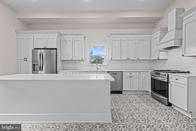 3 E Poplar St, Wenonah, NJ 08090 - kitchen with stainless steel appliances, custom exhaust hood, decorative backsplash, white cabinets, and recessed lighting
