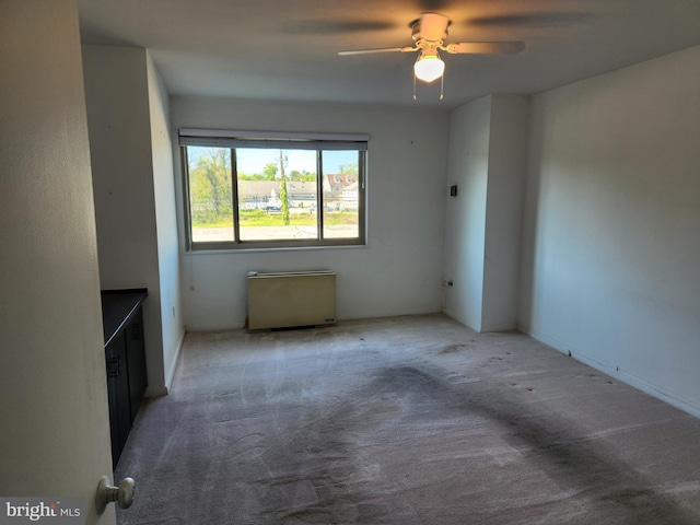 7121 Park Heights Ave Unit 206, Baltimore, MD 21215 - unfurnished living room featuring carpet floors and ceiling fan