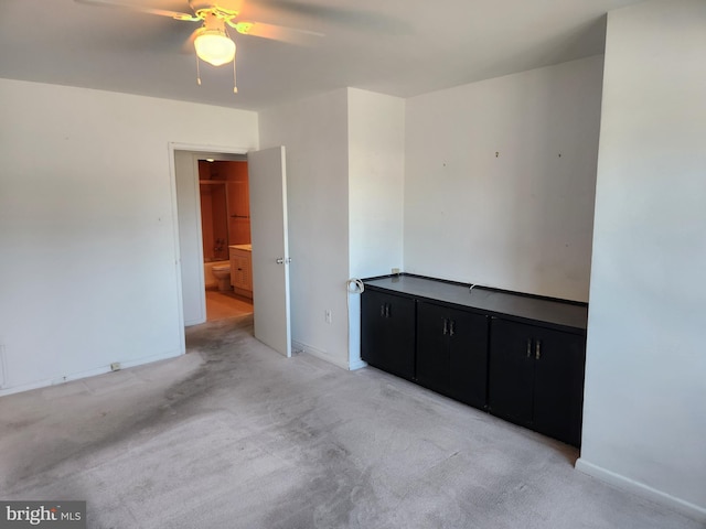 7121 Park Heights Ave Unit 206, Baltimore, MD 21215 - unfurnished room with ceiling fan, light colored carpet, and baseboards