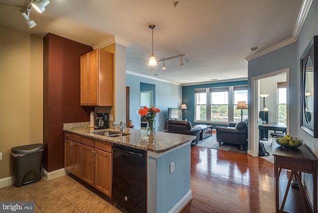 1391 Pennsylvania Ave SE Unit 471, Washington, DC 20003 - kitchen with rail lighting, black dishwasher, a sink, a peninsula, and crown molding