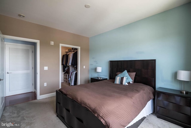 1391 Pennsylvania Ave SE Unit 471, Washington, DC 20003 - carpeted bedroom with a walk in closet, a closet, and baseboards
