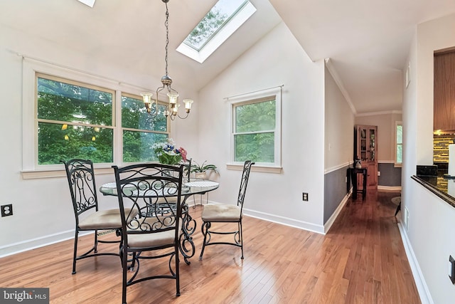 4270 Deborah Ct, Mount Airy, MD 21771 - dining space featuring a skylight, light wood-style floors, a chandelier, baseboards, and vaulted ceiling