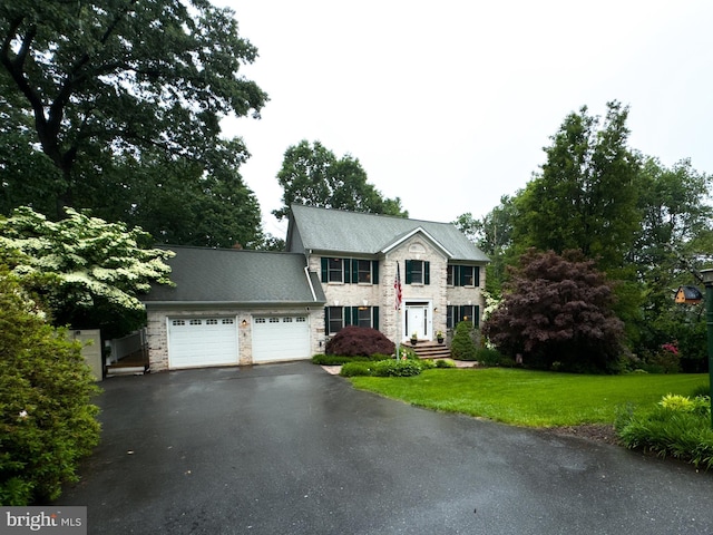 4270 Deborah Ct, Mount Airy, MD 21771 - colonial inspired home featuring stone siding, driveway, a garage, and a front lawn