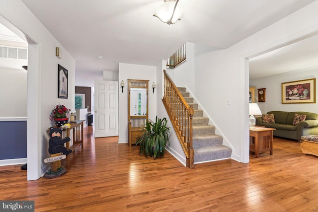 4270 Deborah Ct, Mount Airy, MD 21771 - foyer entrance with wood finished floors, stairway, and baseboards
