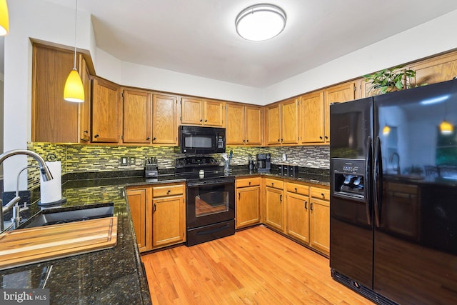 4270 Deborah Ct, Mount Airy, MD 21771 - kitchen featuring black appliances, brown cabinetry, a sink, and backsplash