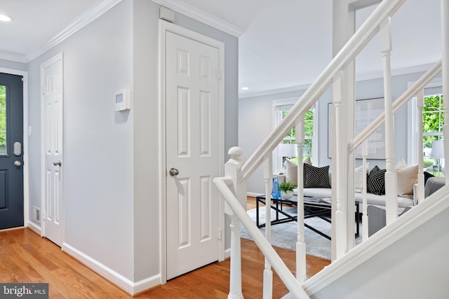 6600 Rockleigh Way, Alexandria, VA 22315 - foyer entrance with healthy amount of natural light, stairs, light wood-type flooring, recessed lighting, and crown molding