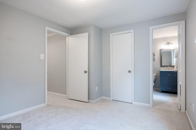 6600 Rockleigh Way, Alexandria, VA 22315 - unfurnished bedroom with light carpet, connected bathroom, and baseboards