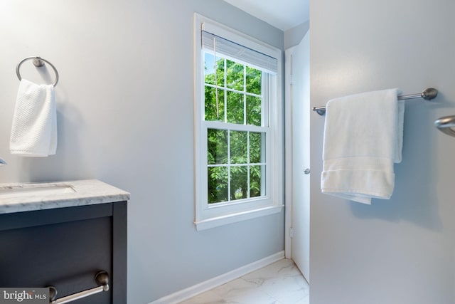 6600 Rockleigh Way, Alexandria, VA 22315 - bathroom featuring marble look tiles, vanity, and baseboards