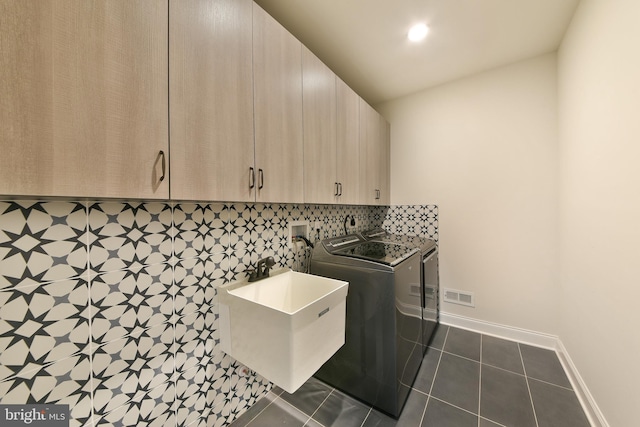 45 Lavender Dr, Yardley, PA 19067 - laundry room featuring washer / dryer, cabinet space, dark tile patterned floors, and baseboards