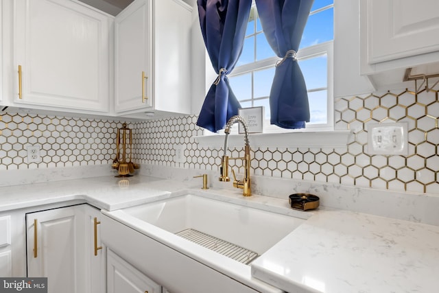 140 N Allwood Dr, Hanover, PA 17331 - kitchen with a sink, white cabinetry, tasteful backsplash, and light stone counters