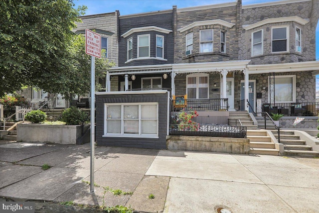 918 Spring St, Reading, PA 19604 - view of property featuring covered porch, stairs, and stone siding