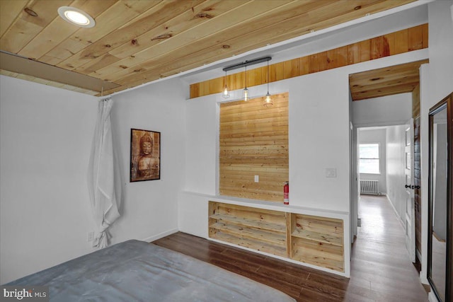 918 Spring St, Reading, PA 19604 - bedroom featuring radiator heating unit, wood finished floors, and wood ceiling