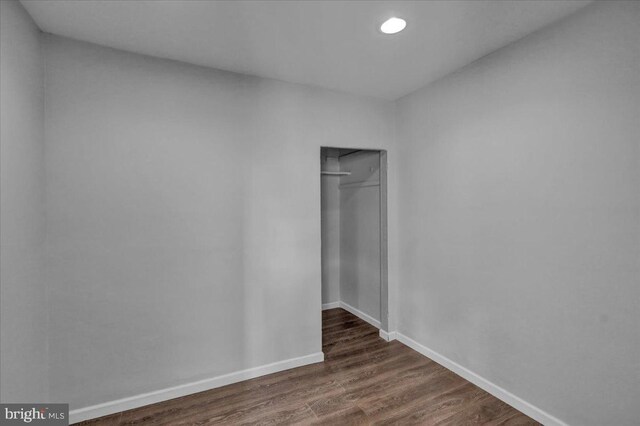 918 Spring St, Reading, PA 19604 - unfurnished bedroom featuring a closet, dark wood finished floors, baseboards, and recessed lighting