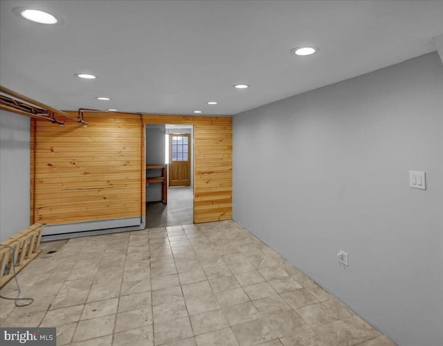 918 Spring St, Reading, PA 19604 - unfurnished room with recessed lighting, a baseboard radiator, and wood walls