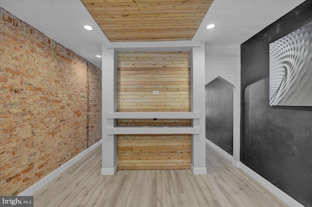 918 Spring St, Reading, PA 19604 - detailed view of brick wall, recessed lighting, wood finished floors, wooden ceiling, and baseboards