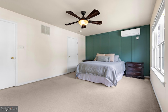 202 Prancer Rd, Egg Harbor Township, NJ 08234 - bedroom featuring a wall mounted air conditioner, light carpet, a decorative wall, a ceiling fan, and baseboards