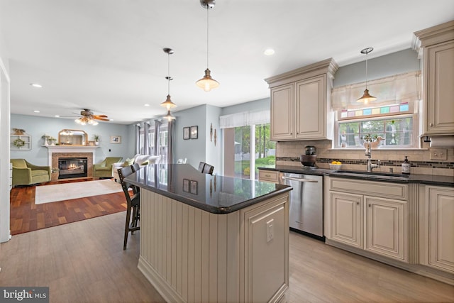 202 Prancer Rd, Egg Harbor Township, NJ 08234 - kitchen featuring stainless steel dishwasher, cream cabinets, a sink, light wood-style flooring, and recessed lighting
