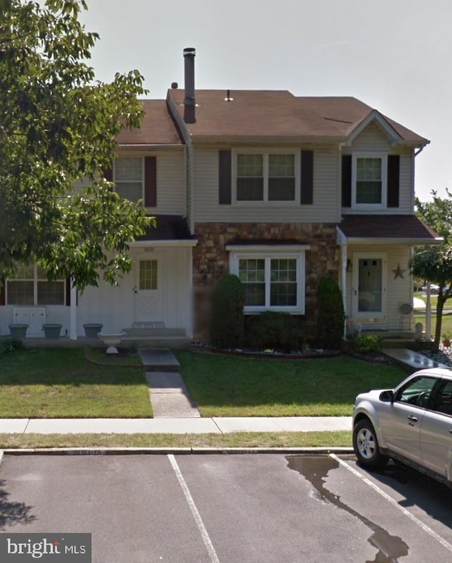 33 Dunmoor Ct S, Hamilton, NJ 08690 - multi unit property featuring uncovered parking, stone siding, and a front yard