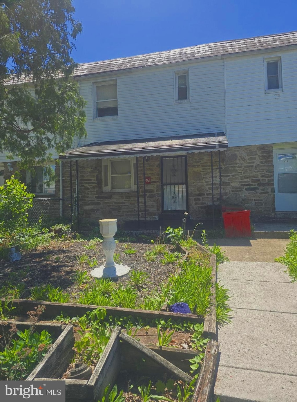 4926 Edgemere Ave, Baltimore, MD 21215 - view of front facade with stone siding and a porch