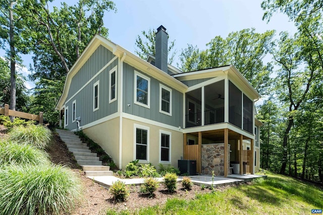 329 Carrsbrook Dr, Charlottesville, VA 22901 - back of house featuring stairway, board and batten siding, ceiling fan, and a chimney